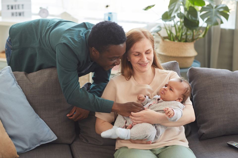 A couple spending time with their baby