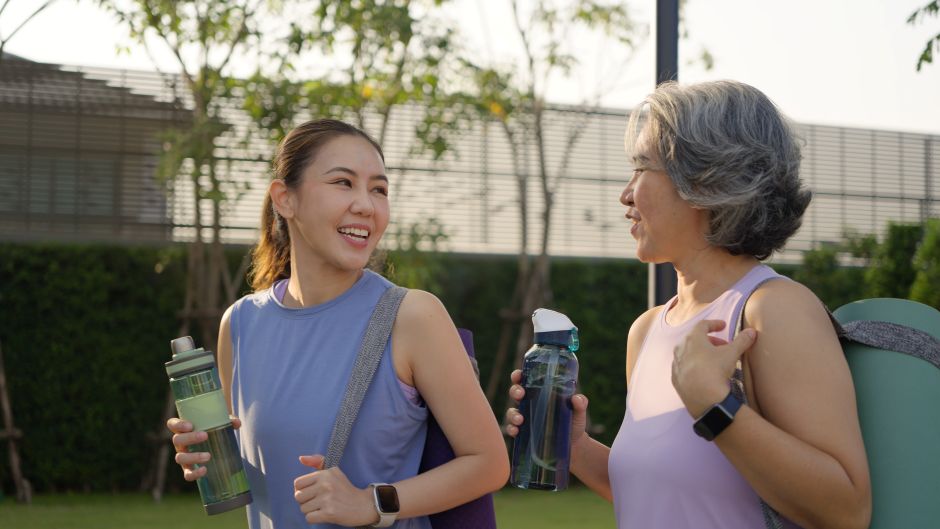 Women walking together, smiling